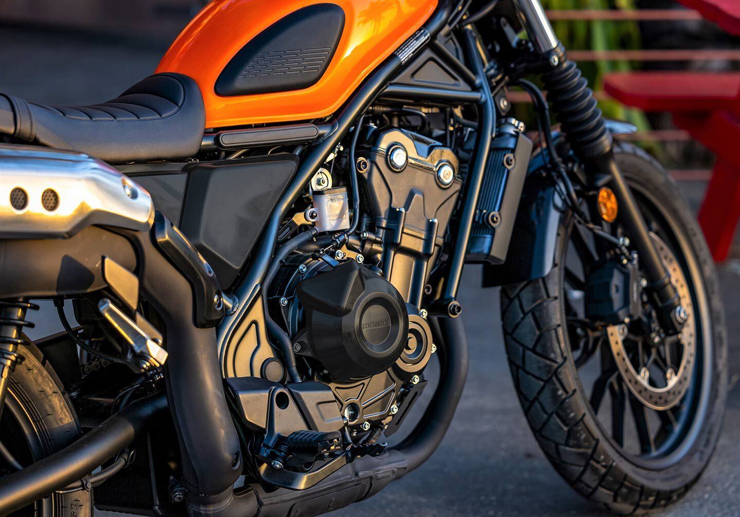Tank pads, fork gaiters, and blacked-out mechanical components are a nod to current styling trends. The taller seat is still just 31.1 inches off the ground.