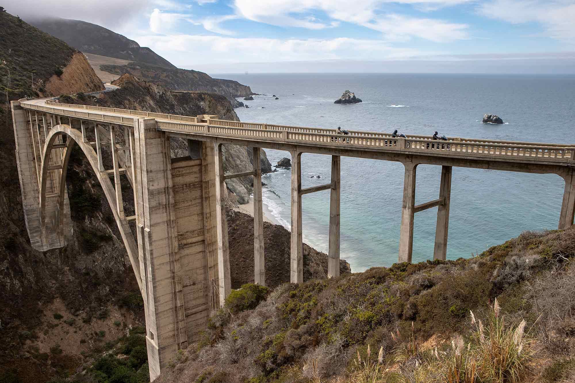 Three baggers crossing Bixby Bridge, the historic landmark that connects northern Big Sur to the rest of Pacific Coast Highway.