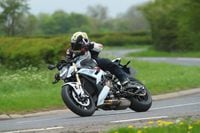 2022 bmw s 1000 r m series cornering on country road