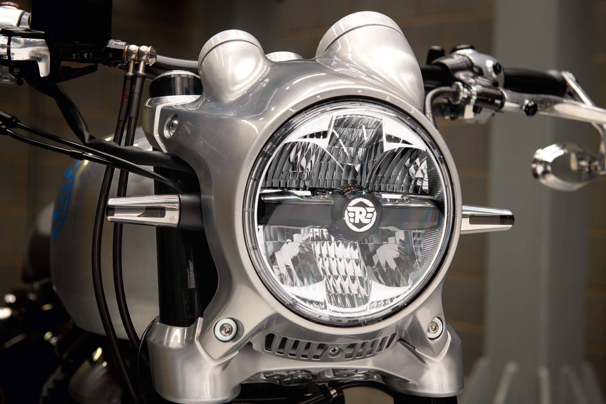 The headlight on the SG650 is machined from billet to house the gauges and bolt directly to the triple clamps.
