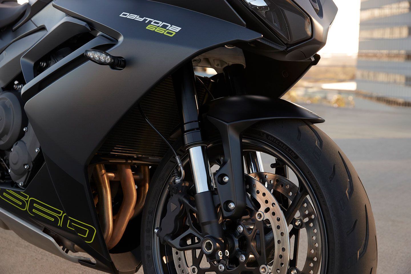 The front end includes a Showa fork, and a pair of radial-mount calipers and 310mm discs.