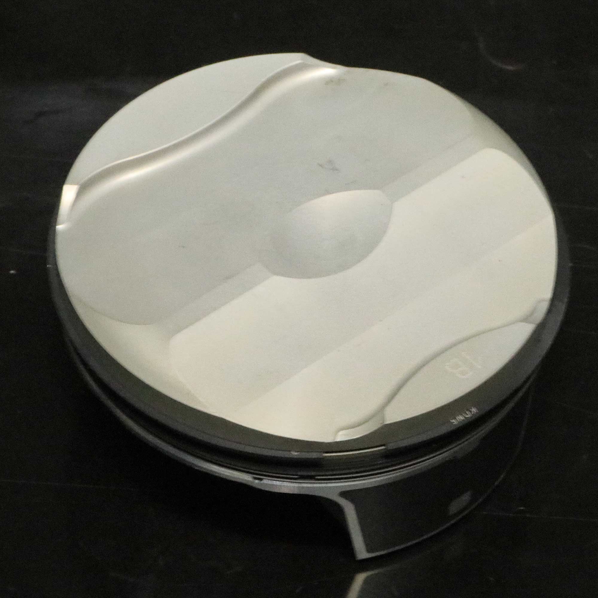 The Panigale V-4 pistons are very light two-segment units, 81mm in diameter. Their crowns closely mirror the head for a very clean combustion chamber.