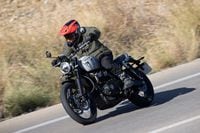 2024 Triumph Scrambler 1200 X riding on mountain road