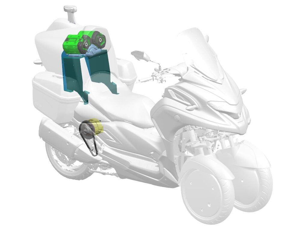 The trike pairs a 5kW electric motor driven by a pair of 56V batteries to work with the Yamaha 292cc single cylinder engine to boost efficiency. The fuel tank and batteries are behind the rider.