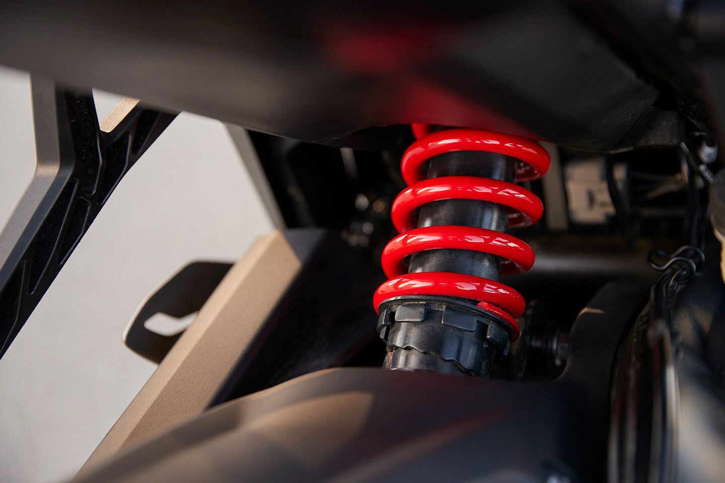 A preload-adjustable Showa shock resides out back.