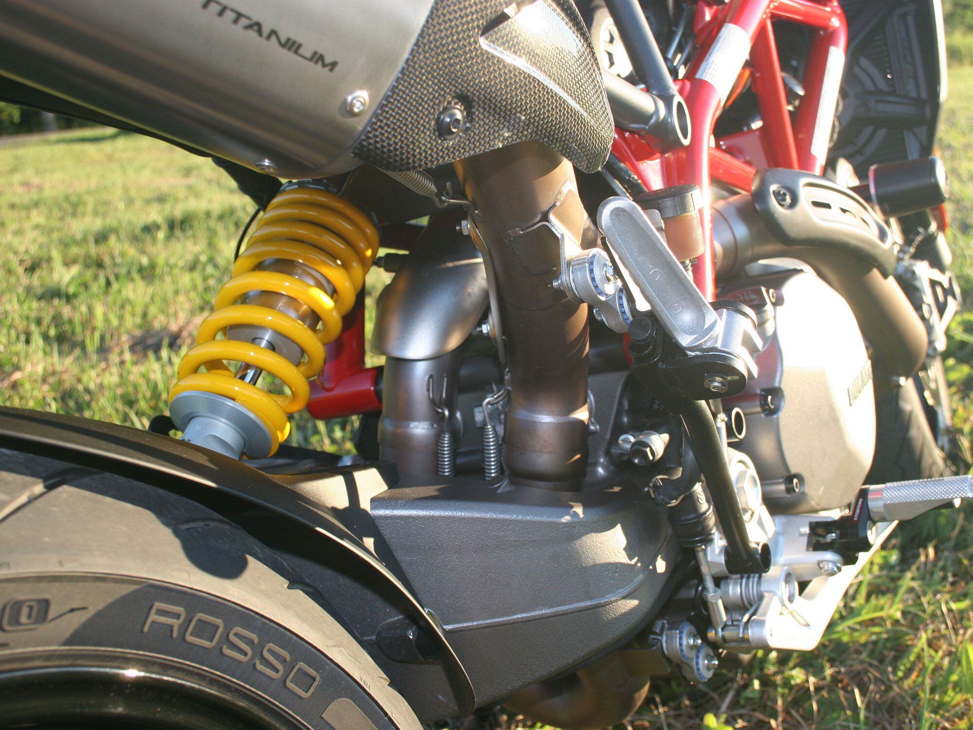 New exhaust routing exposes the swingarm.