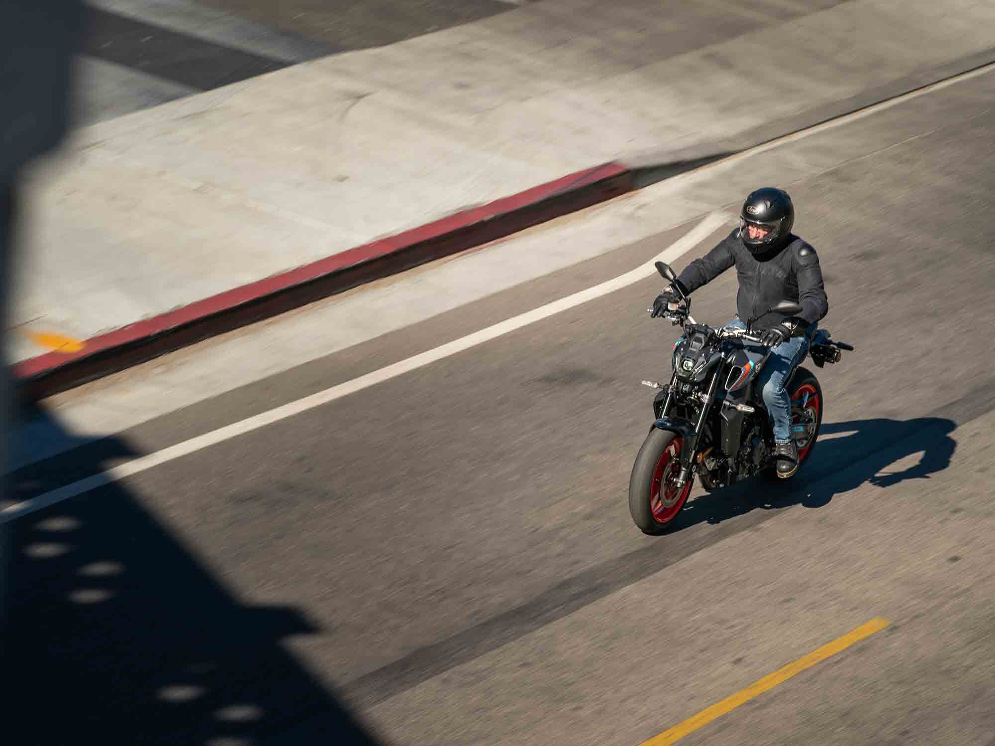 Just a slight lean forward to the bars and pegs right beneath you give the MT-09 a sporty feel.