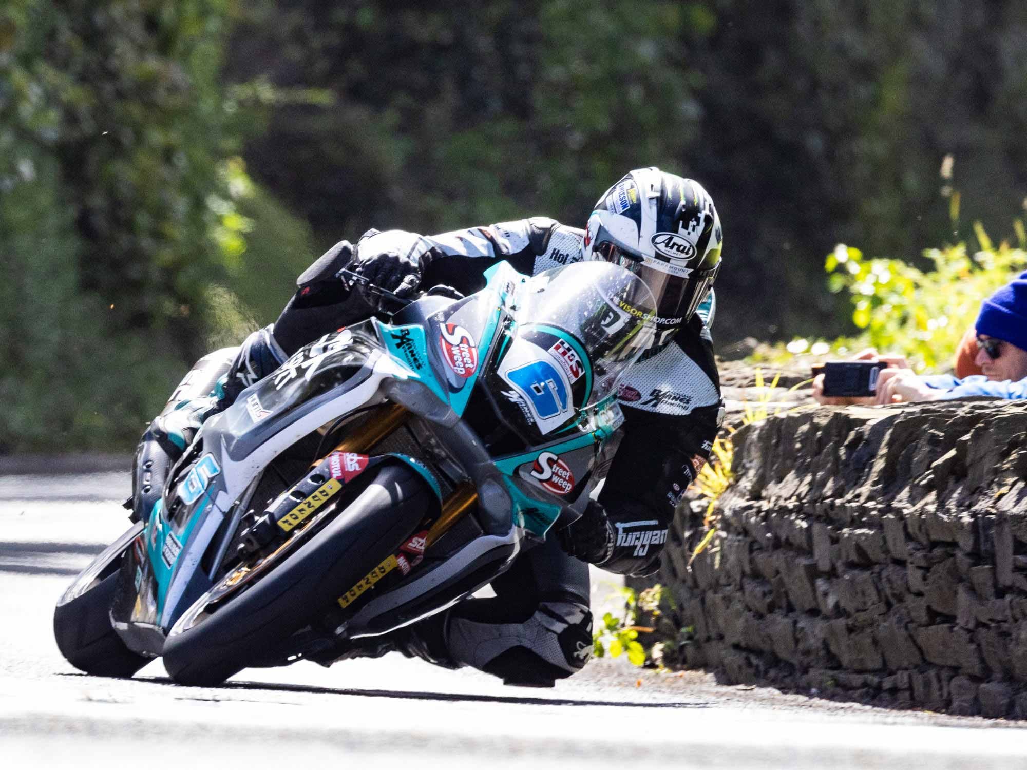Friday of race week is a bank holiday and businesses are closed. Senior Friday is the main event of the TT, but with weather cancellations and incident delays, the Supersport Race also had to be run on Friday. Dunlop (6) took his 600 Yamaha to his 21st victory and is now only two wins behind McGuinness’ 23.