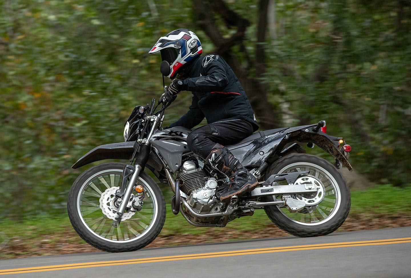 At the apex, the 2023 Kawasaki KLX230 S suspension manages to stay up in the stroke, further improving rider confidence.