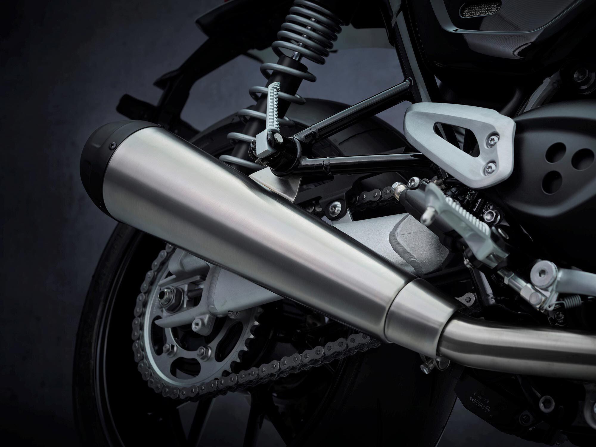 Super-clean, all-stainless exhaust ends in twin upswept mufflers.