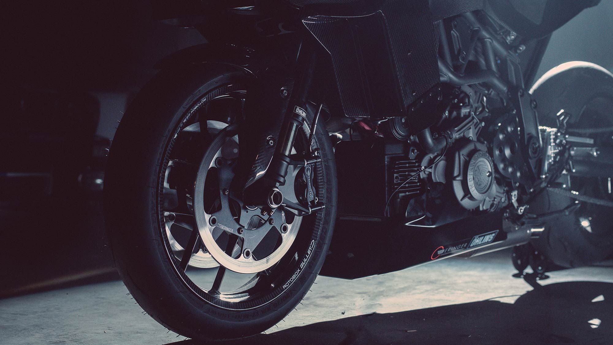 Darkened Öhlins suspension and carbon highlight the front of this Black Swan.