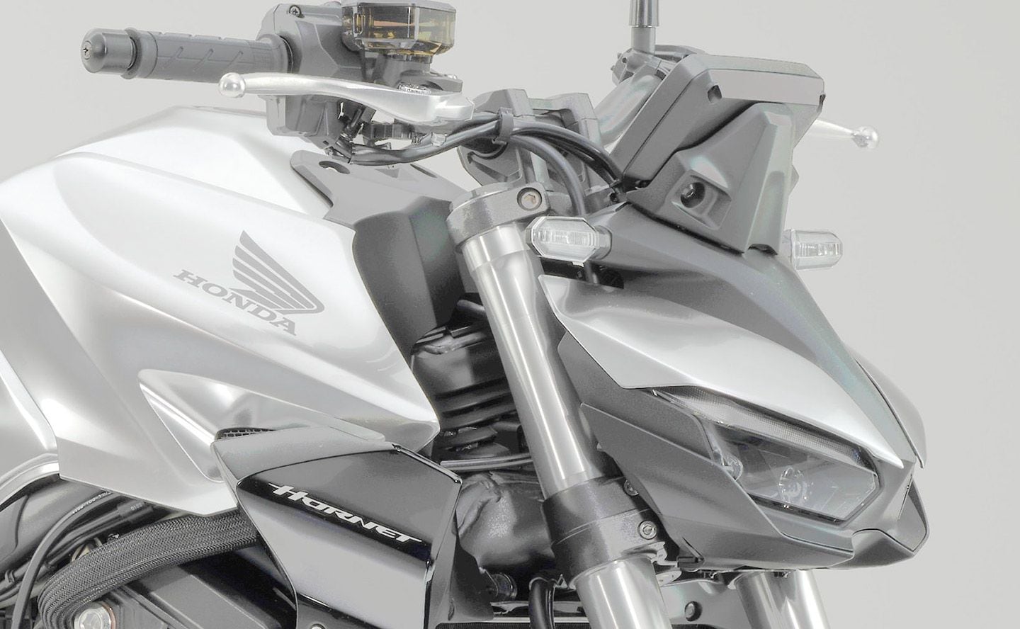 Hidden at the front of the tank behind the front cowl are the new cold-air intakes that this patent addresses.