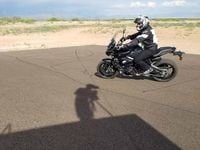 chris peris rides motorcycle at riding school