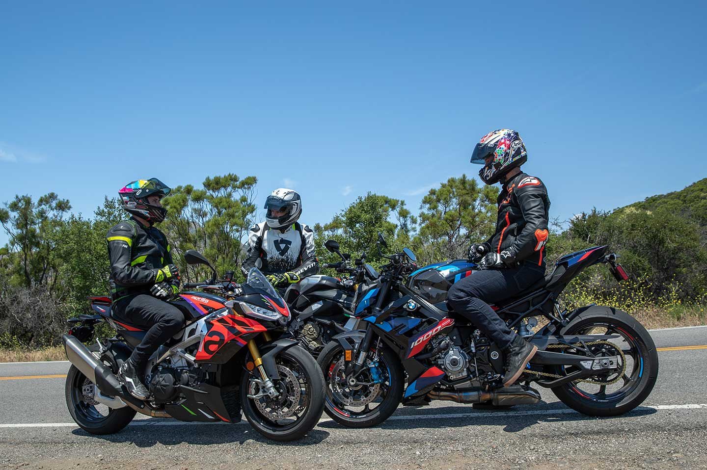 Two of these bikes, the Aprilia and BMW, use traditional perimeter-style frames, while the Ducati uses a “front frame” that depends much more on the engine as a stressed member.