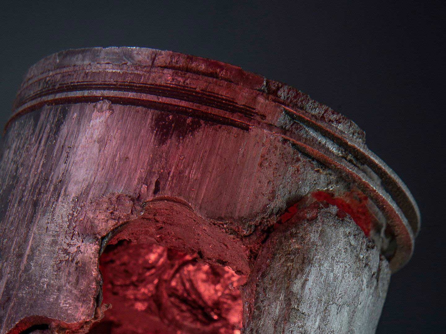 Detonation erodes a piston’s ring land as shockwaves pound softened aluminum material.