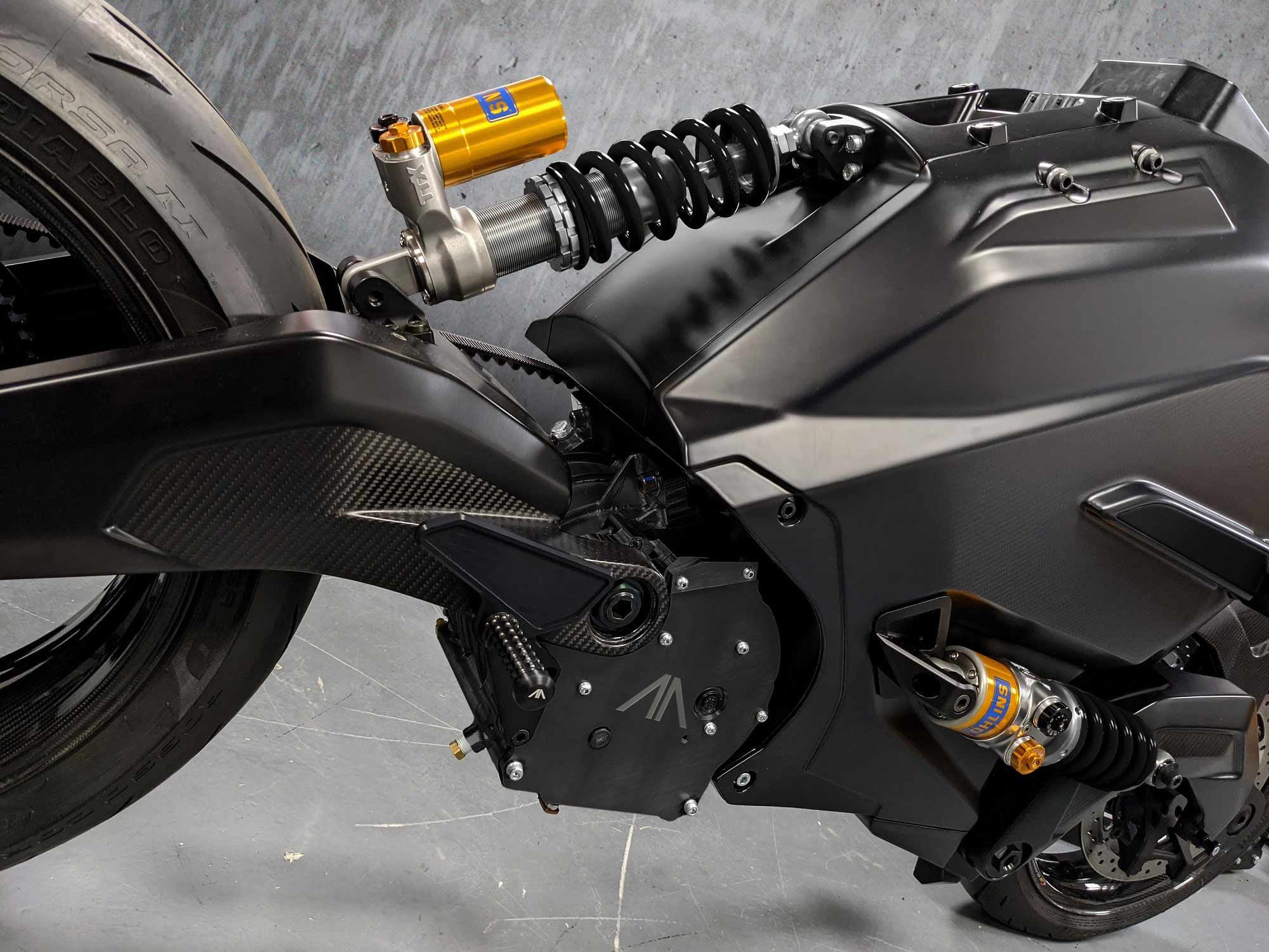 An Öhlins rear shock bolts to the battery module and acts directly against the monocoque chassis.