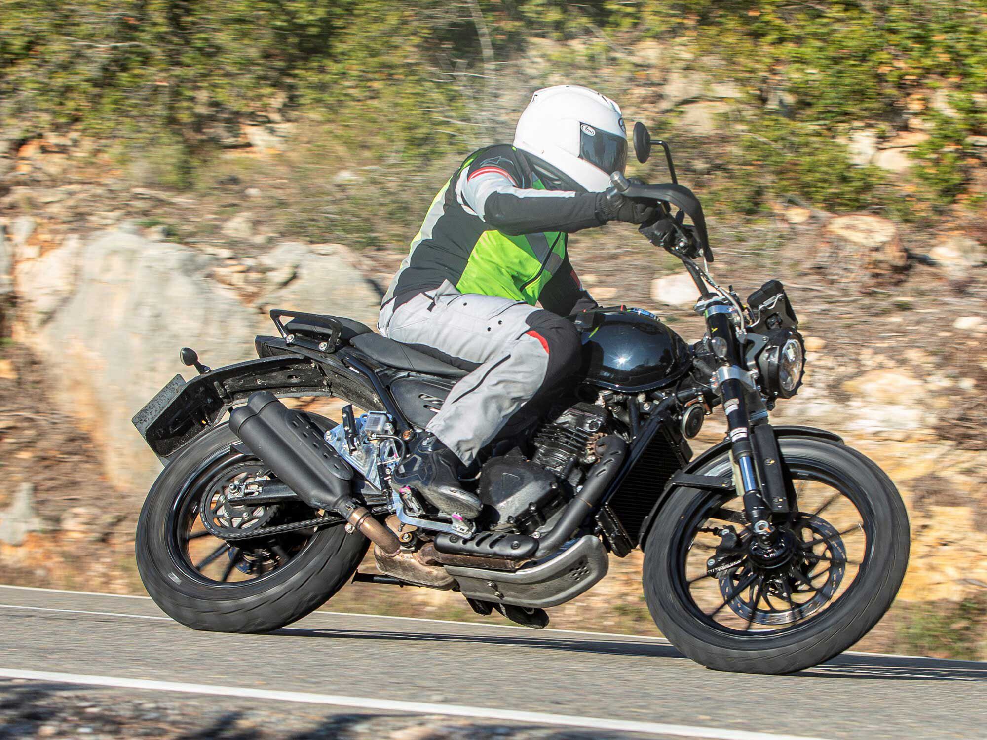 The second bike is more scrambler-styled, with a larger front wheel, skid plate, and higher-mounted dual exhausts.