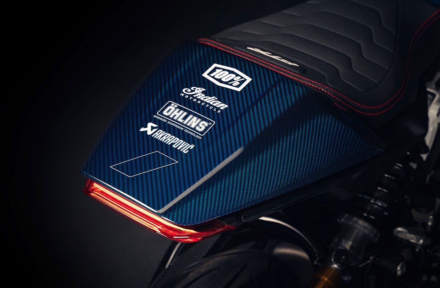 The FTR x 100% bike is swimming in carbon fiber, custom paint, and premium components.