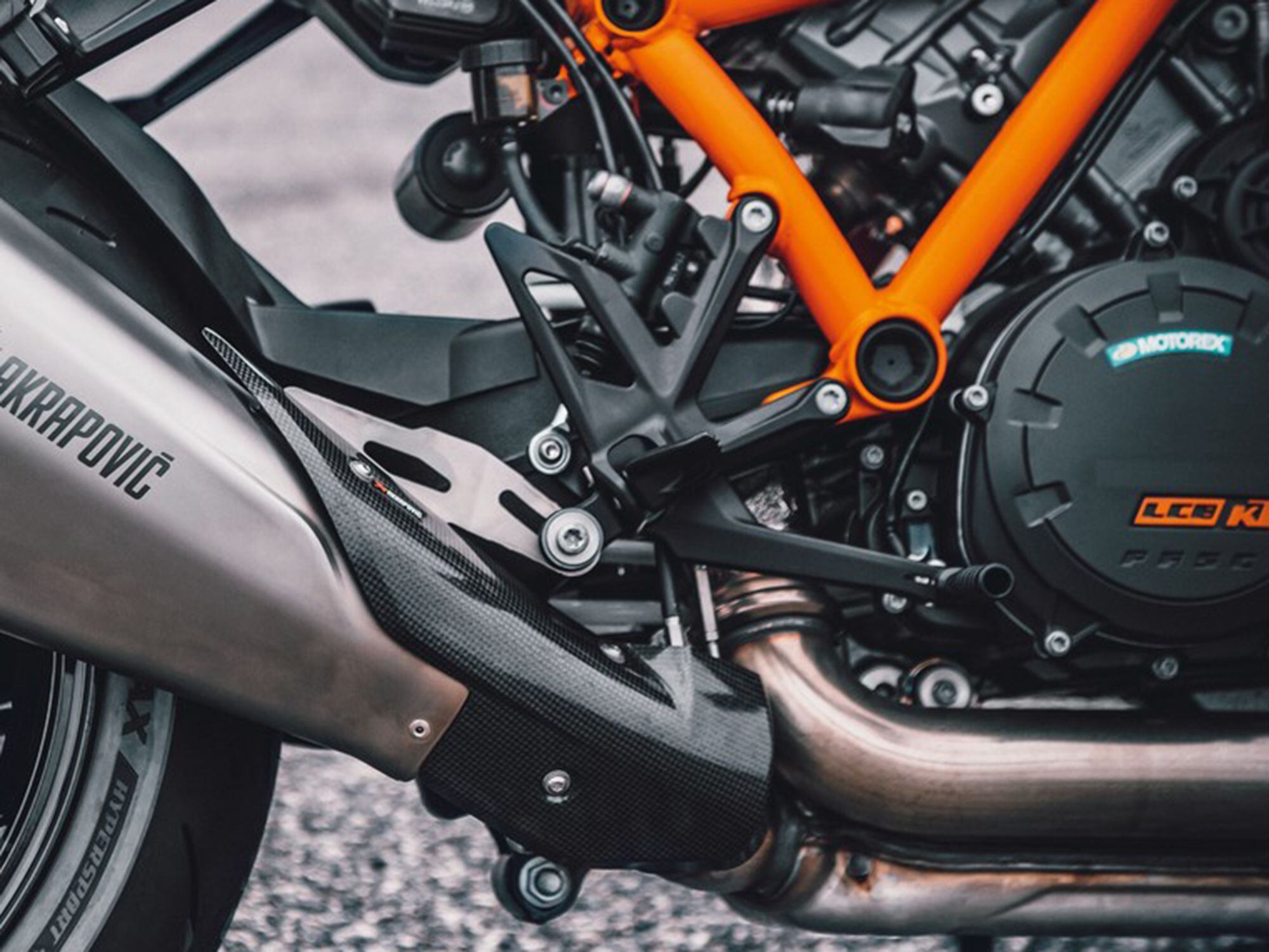 Lighter wheels and/or machined triple clamps and footpegs might also appear on the new bike. We’ll find out soon enough.