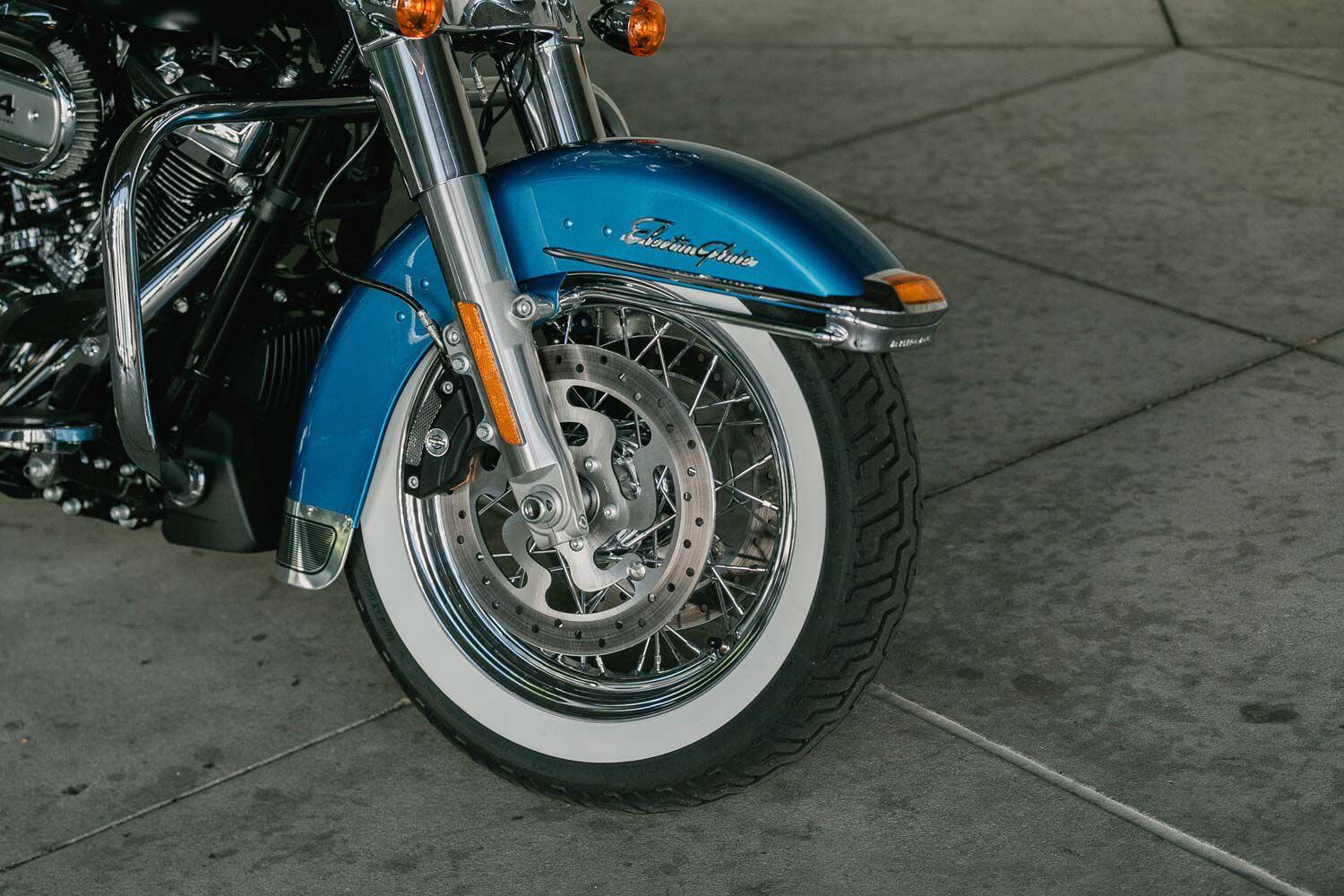 Whitewall tires on 16-inch chrome spoked tires.
