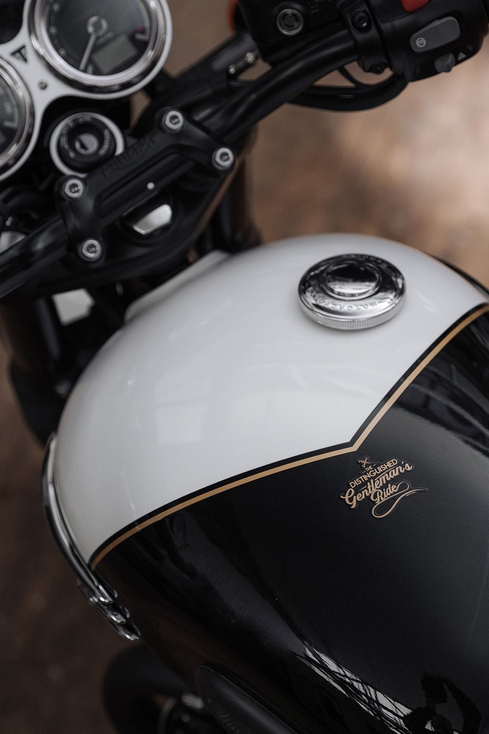 The 2023 DGR logo and hand-painted pinstripes shown on the two-tone tank.