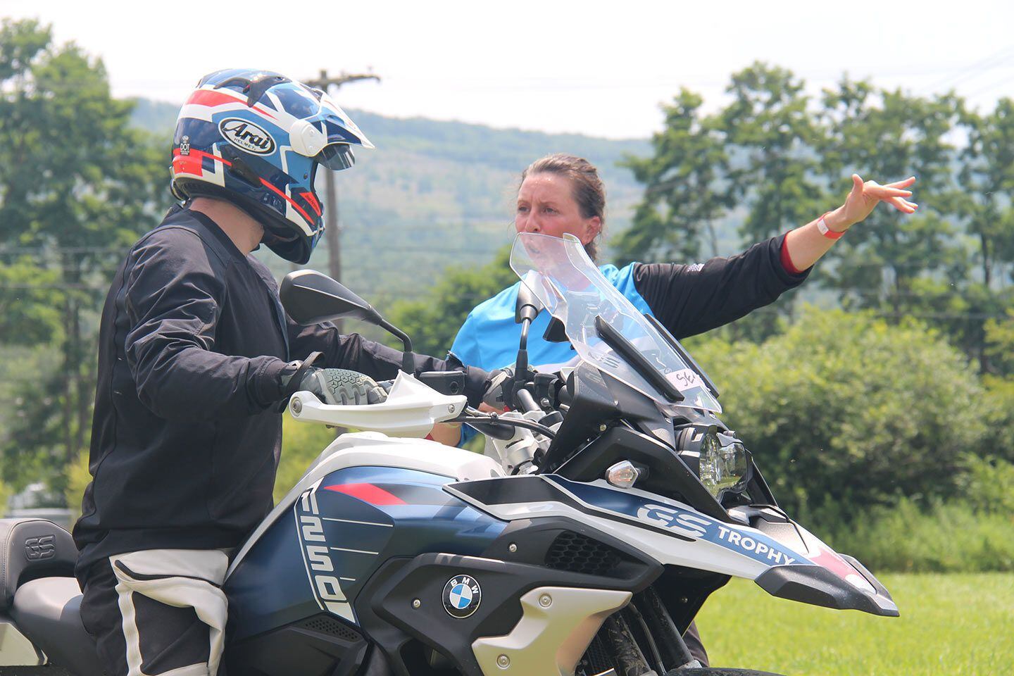 Training at the Soggy Bottom MotoFest in Port Matilda, Pennsylvania, on a muggy 95-degree day. Louise Powers, director of BMW Motorcycle Owners of America and instructor with Stromoto, provides direction.