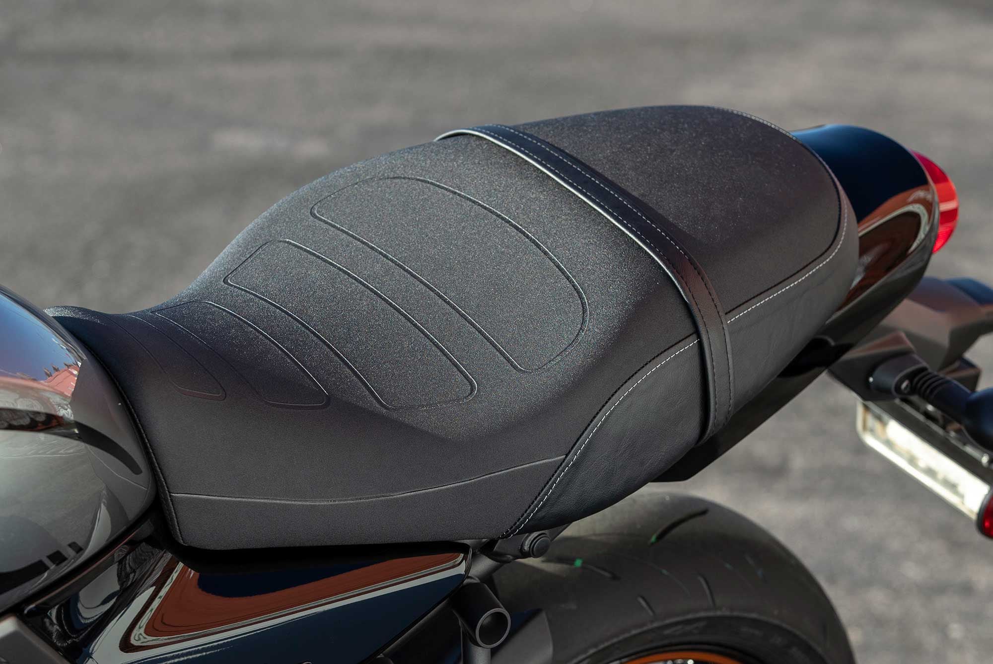 The Z650RS-specific seat is designed to be slimmer up front for easy reach to the ground. You can also remove it to access the fuse box as well as an included… wait for it… tool kit.