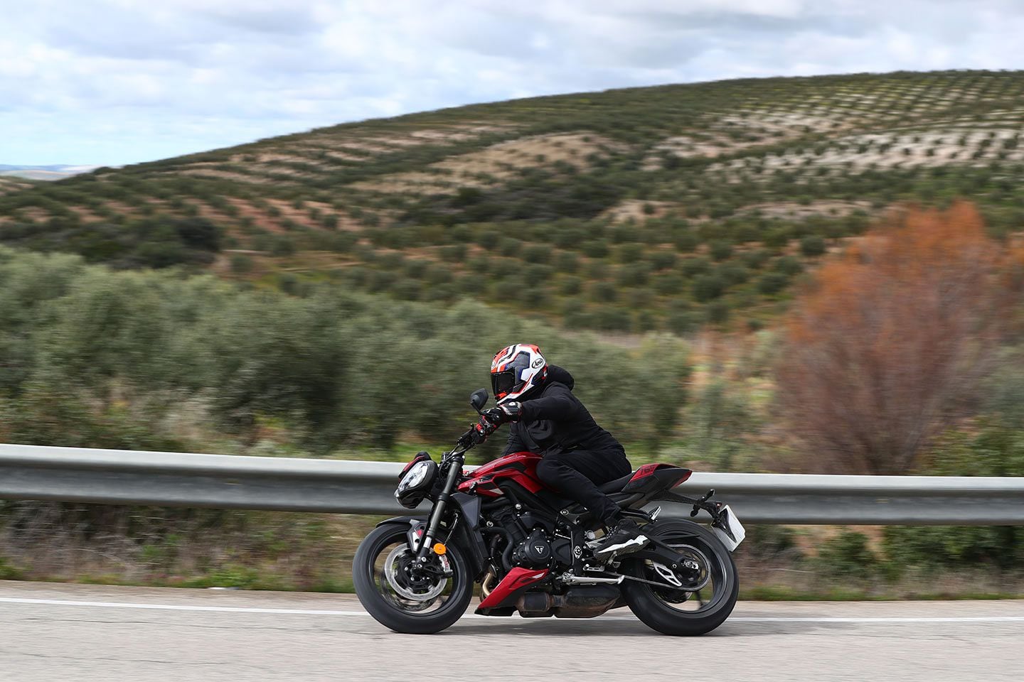 The Street Triple 765’s sportbike roots are obvious in the relatively high, rearward positioned footpegs. The gap between seat and pegs can feel tight for anyone over 6 feet tall.