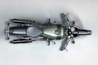 A better view of the Shotgun’s solo-seat configuration, wider bars, mid-mount controls, and differently shaped fuel tank.