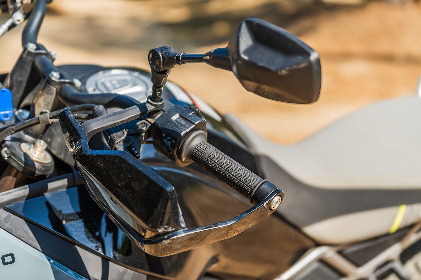 Mirrors fold at the elbow so that they can be positioned out of the way when standing up over the front of the bike.