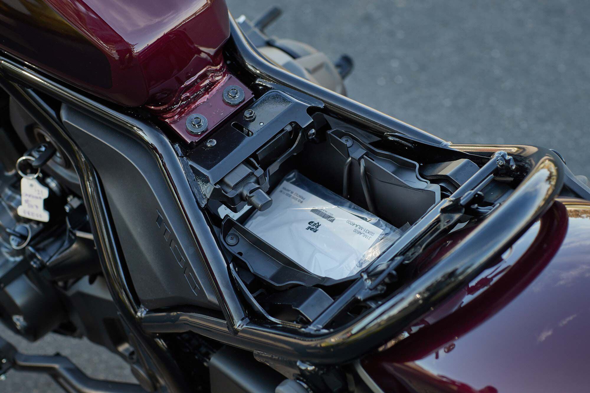 Three liters of storage and a USB-C charging port are located beneath the seat of the Rebel 1100.