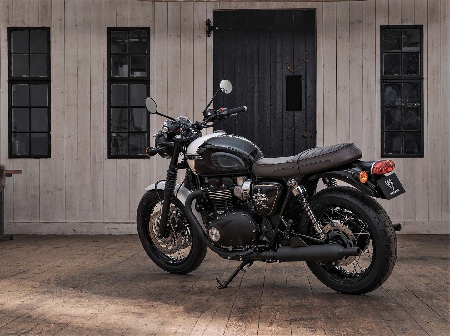 Other than the tank and front fender, the DGR bike retains much of the stock T120 Black’s blacked out treatment.