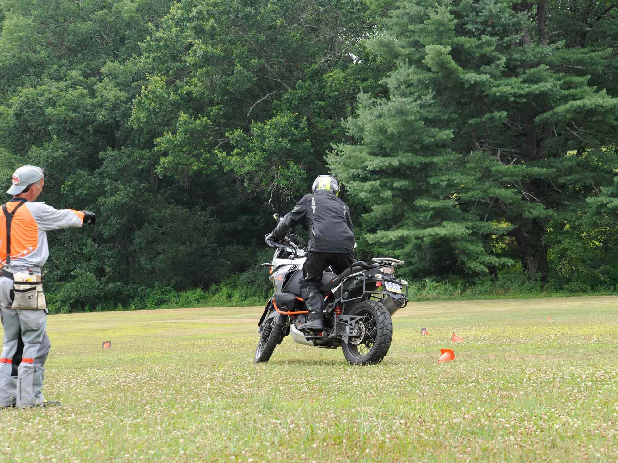 Ufberg points at something as the author countersteers a 520-plus-pound bike.