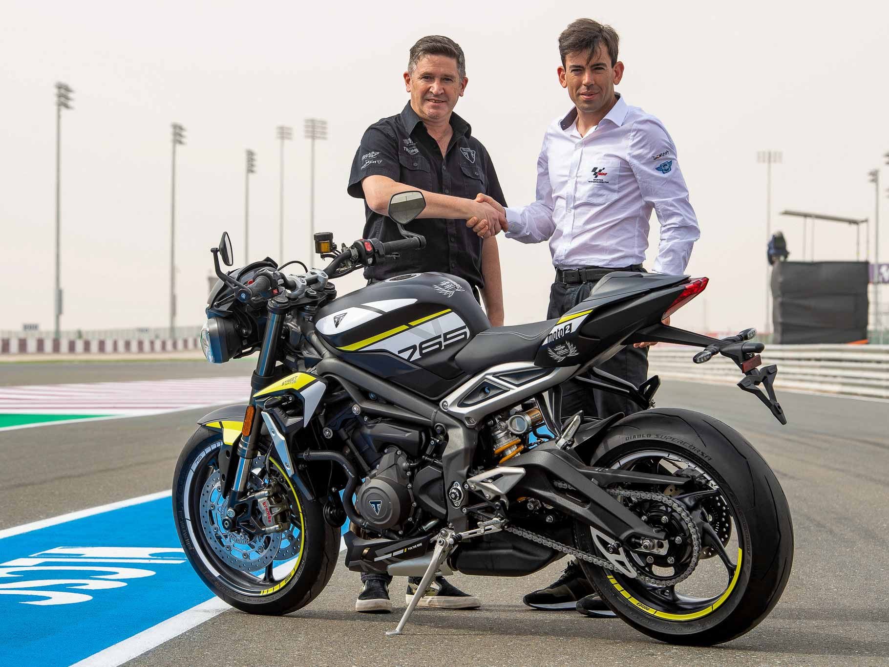 Steve Sargent, Triumph Motorcycles chief product officer, and Carlos Ezpeleta, Dorna Sports managing director, unveil the Street Triple RS that will go to the Triumph Triple Trophy winner. 