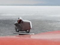 el camino hood ornament in front of bonneville salt flats