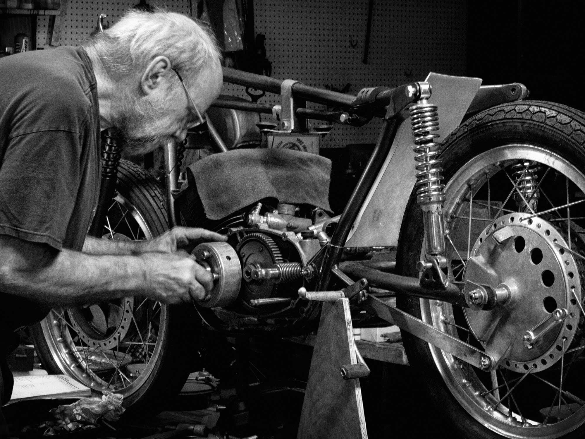 Kevin Cameron in his shop assembling a Yamaha TD1-B 250.