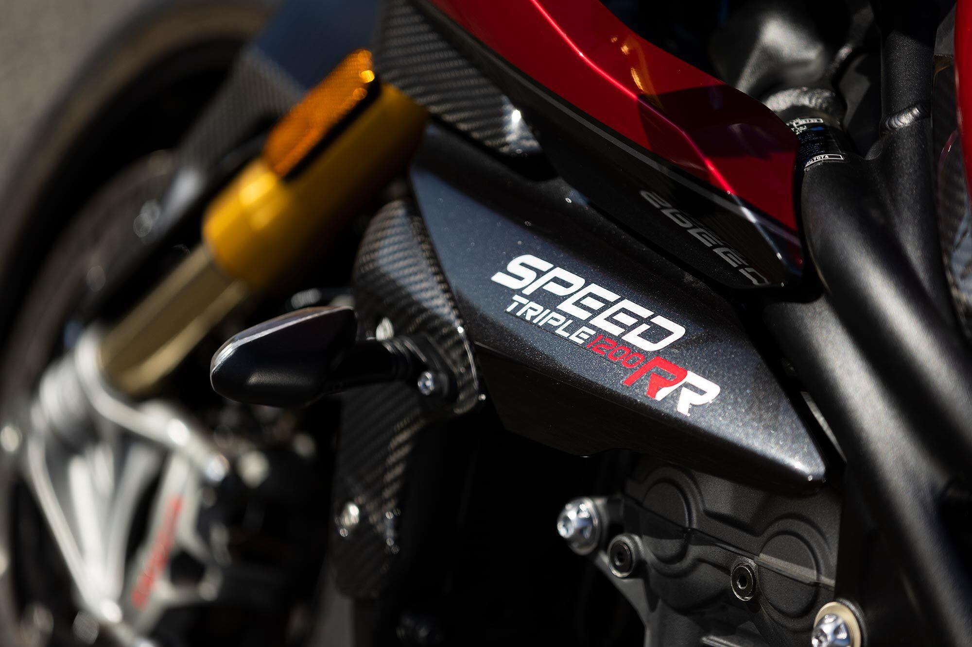 Rich red paint and plenty of carbon fiber suit the sublime character of Triumph’s Speed Triple 1200 RR.