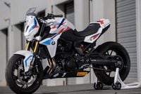 bmw f 900 r cup parked near paddock right side angled profile