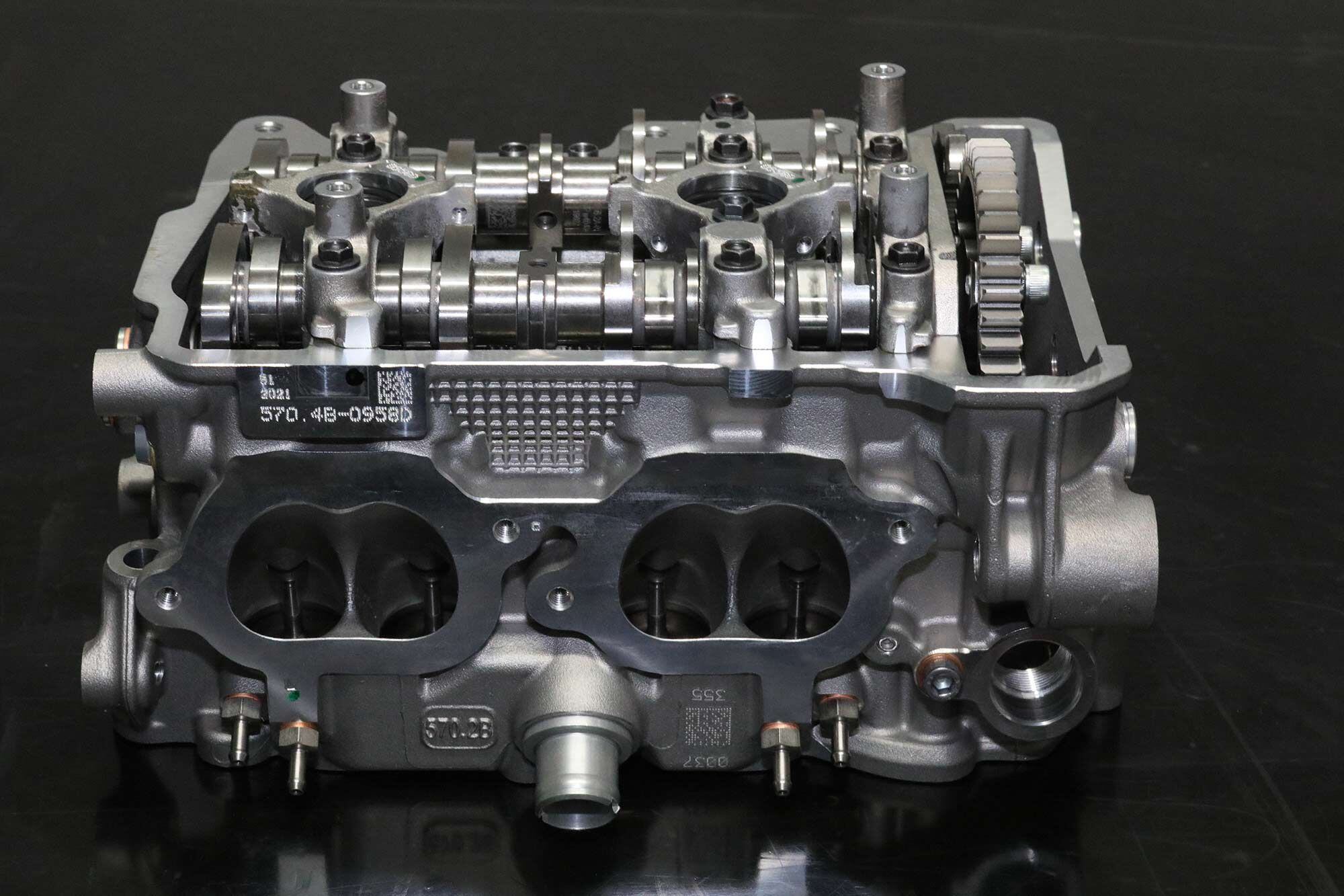 The Ducati Panigale V-4 desmo heads are gravity die-cast, for both superior tensile quality and an extremely clean look. Cam drive is via Morse chain and gears; the camshafts run in three cap-type aluminum bearings.