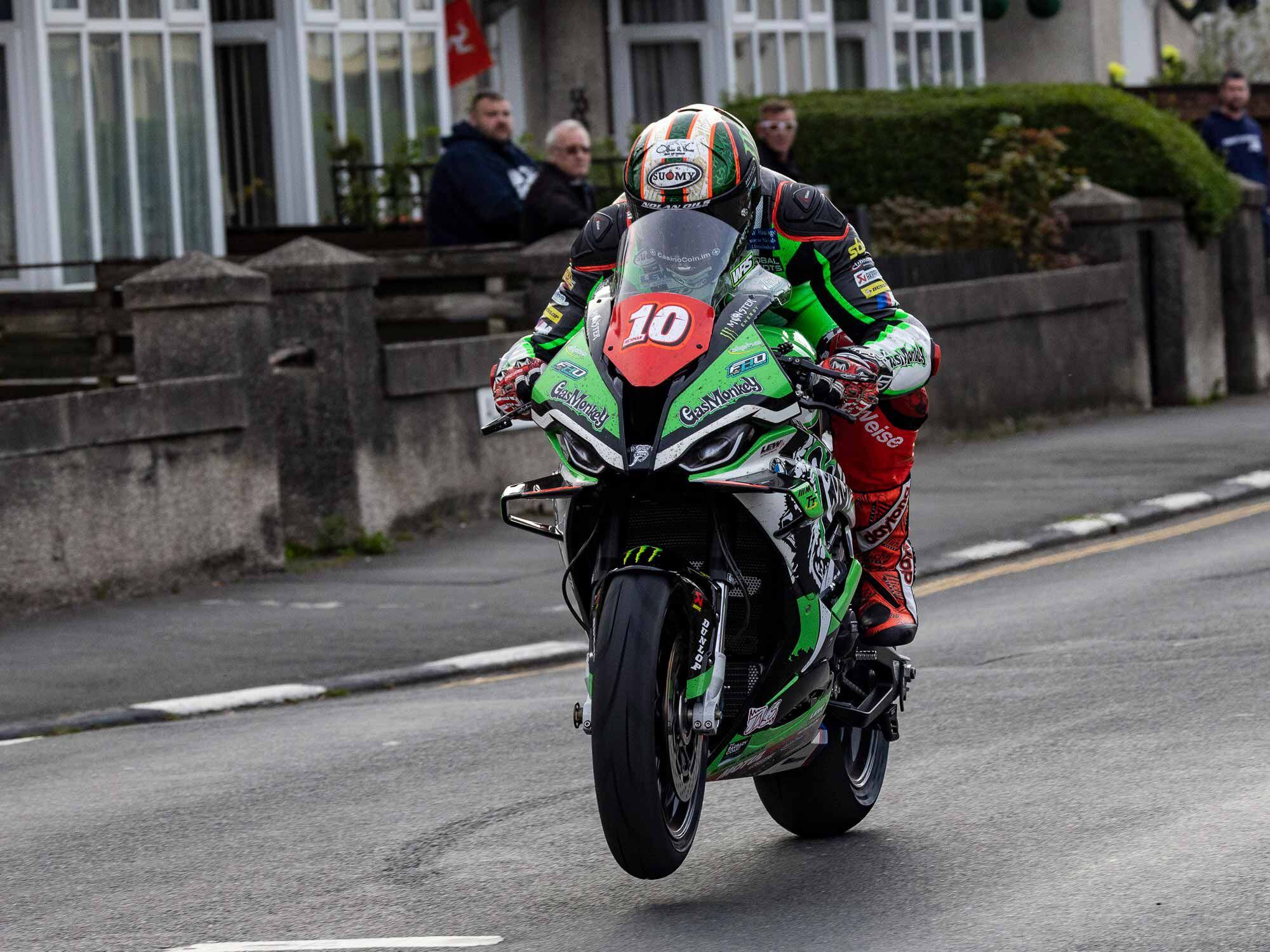 Having made up most of his 60-second gap on Hutchinson, eventual RL360 Superstock race winner Hickman lifts the front wheel of his FHO Racing BMW M 1000 RR with each gearshift out of Parliament Square on his way to his second TT victory of the week, capping it off with a 133.5 mph final lap.