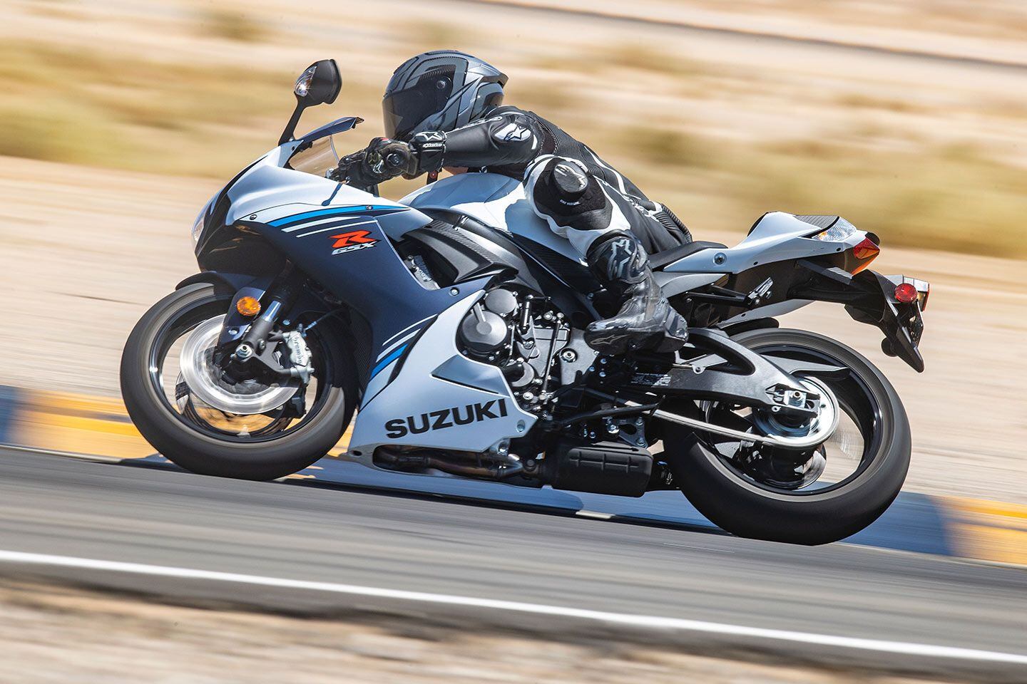 The contour of the tank and bodywork provides a flat surface area for the rider to grip the bike.