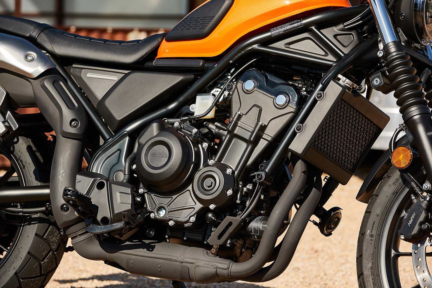 The 471cc parallel-twin engine is identical to what powers the rest of Honda’s 500 models, including the CBR500R, CB500F, CB500X, and Rebel 500. Honda has, however, updated the intake and given the SCL500 a one-tooth-larger rear sprocket, when compared to the Rebel 500. Notice the scuff on the exhaust heat shield, from where your boot rubs.