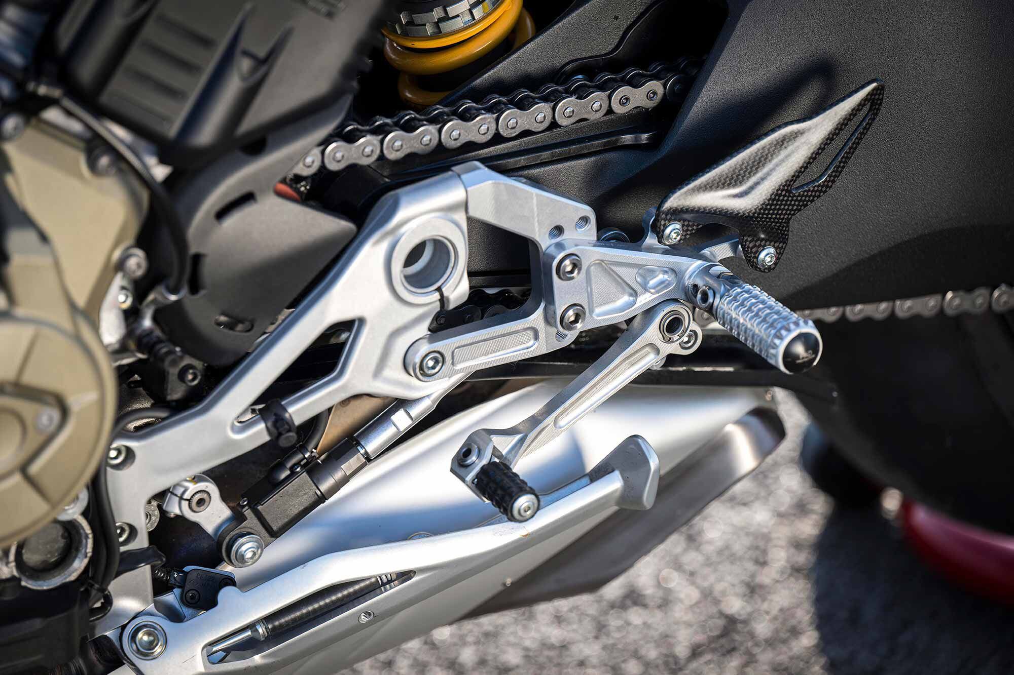 Slightly higher footpeg placement along with suspension that sits higher in the stroke while concerning increases the available lean angle.