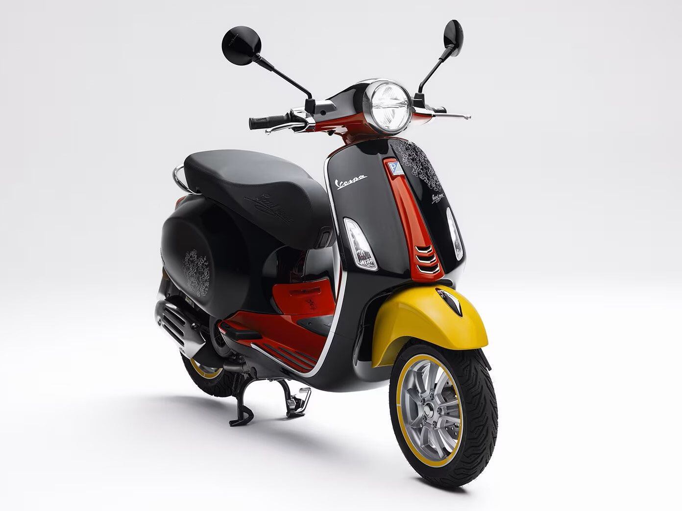 The Vespa Mickey Mouse edition scooter comes with a matching helmet in the same colors.