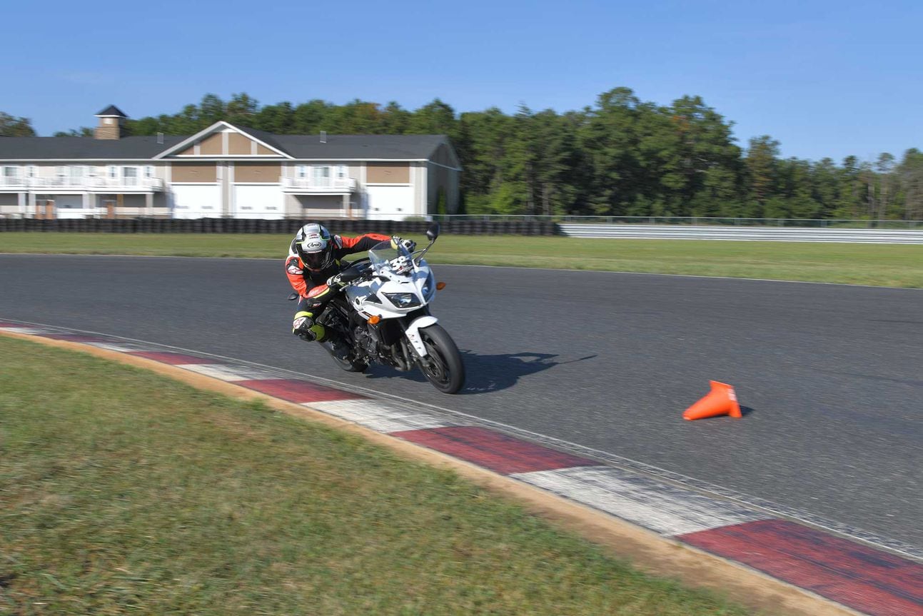 Yamaha Riding School instructor demonstrating the way through the cones.