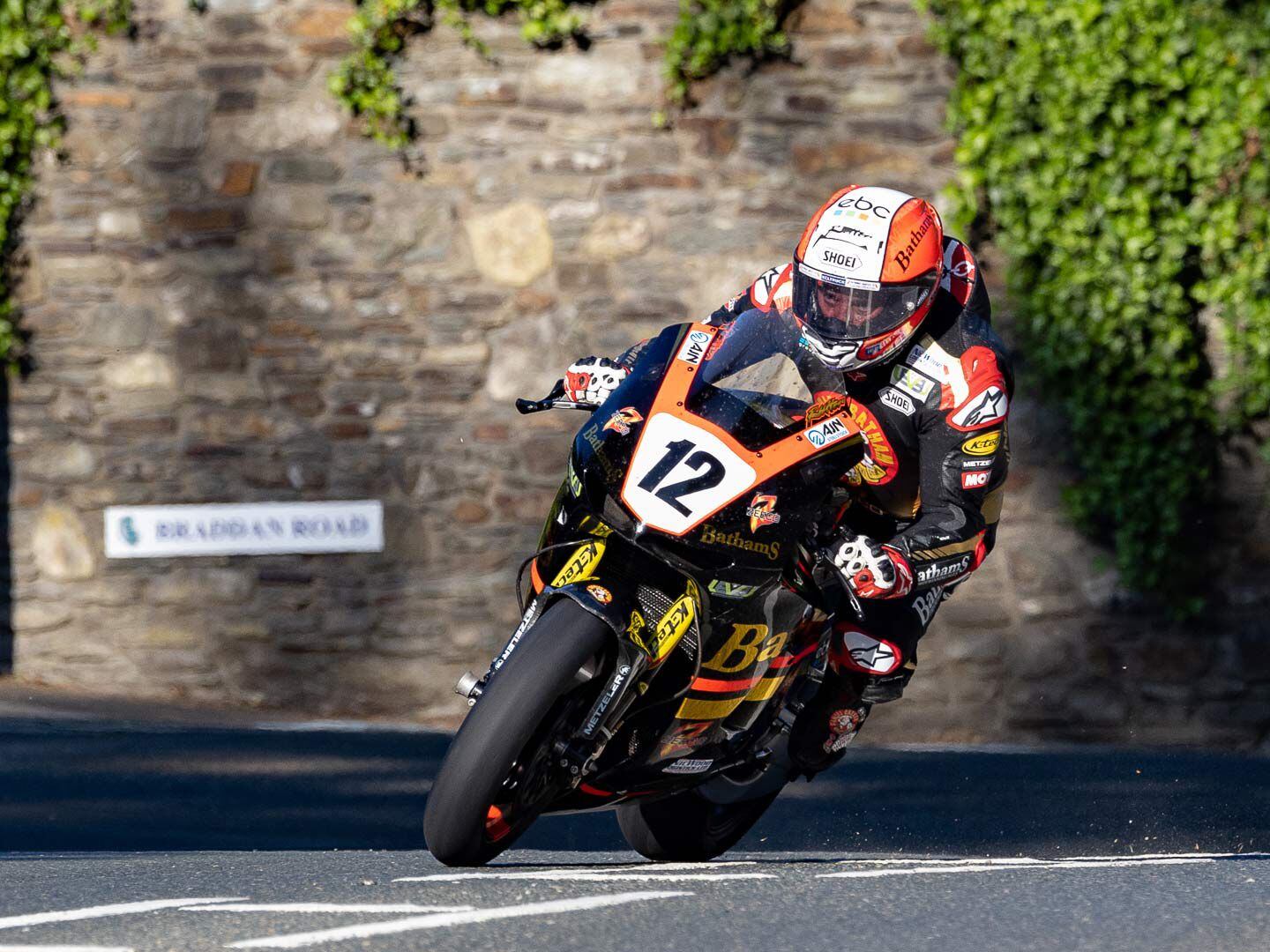 From the evening shadows to the bright sunlight Michael Rutter takes practice laps on his Honda RC213V-S Superbike. With more than 80 TT starts, Rutter is always a factor on the course.