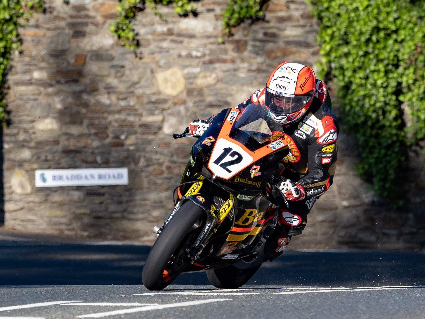 From the evening shadows to the bright sunlight Michael Rutter takes practice laps on his Honda RC213V-S Superbike. With more than 80 TT starts, Rutter is always a factor on the course.