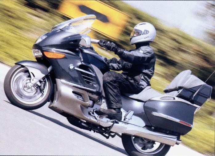 The previous electrohydraulic centerstand from BMW’s 2004 K1200LT required the rider to press a button and then wait for the system to slowly jack the bike up onto the stand.