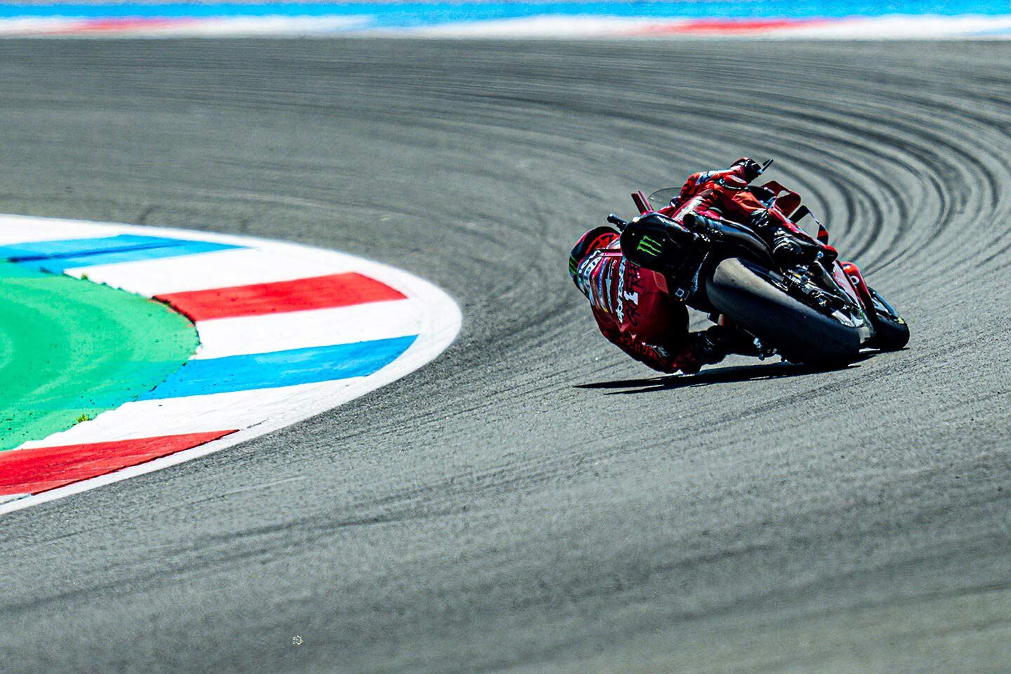 Bagnaia hanging off to the inside.