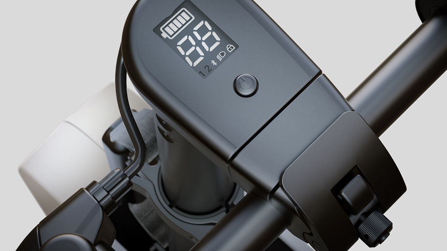 An LED display shows battery charge, speed, selected ride mode, and more.